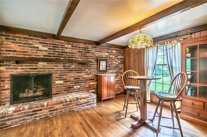 144 Berwyn Road Pittsburgh, PA 15237 - Photo 13 of 25 Den features gas/wood burning fireplace and rustic beams.