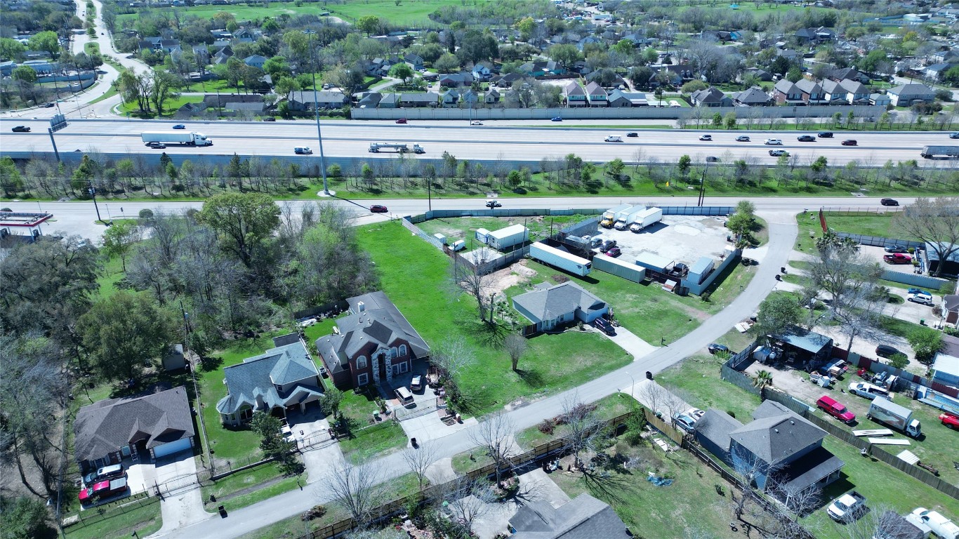 6633 Tadlock Lane Houston, TX 77085 - Photo 3 of 4 an aerial view of a yard and lake view