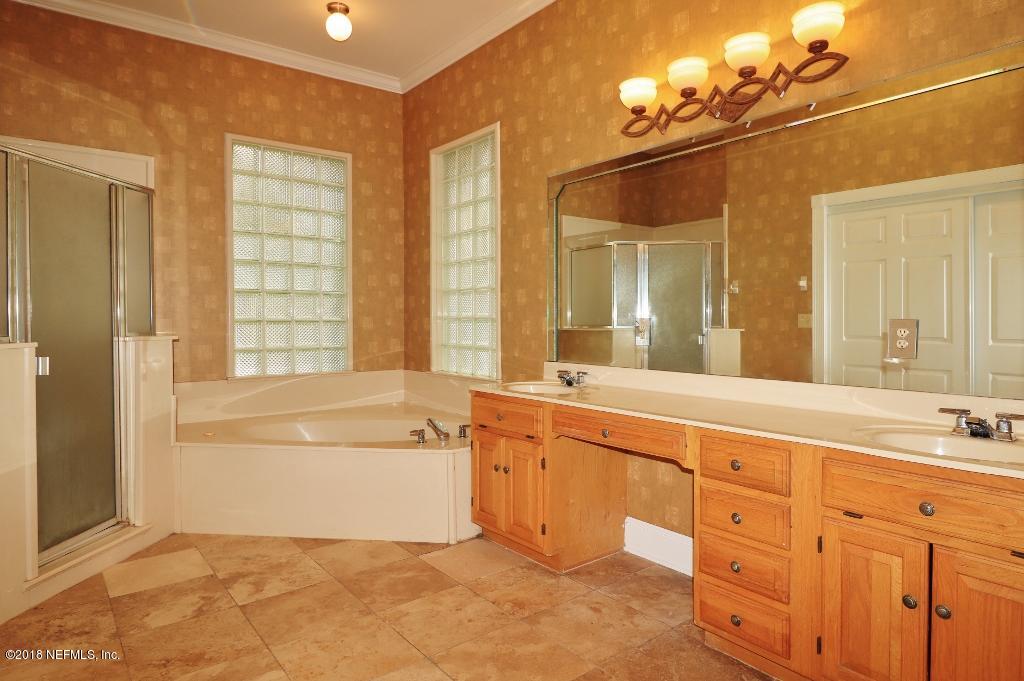 1899 Commodore Point Drive Orange Park, FL 32003 - Photo 23 of 52 a spacious bathroom with a tub sink and mirror