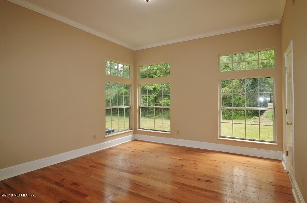 1899 Commodore Point Drive Orange Park, FL 32003 - Photo 28 of 52 a view of an empty room with wooden floor and a window