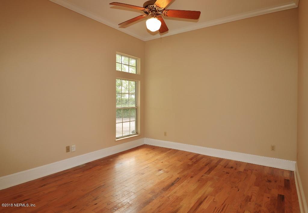 1899 Commodore Point Drive Orange Park, FL 32003 - Photo 29 of 52 a view of an empty room with window and wooden floor