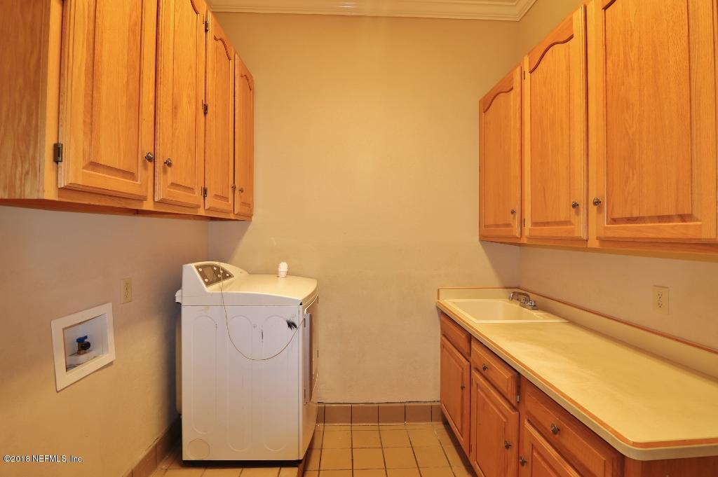 1899 Commodore Point Drive Orange Park, FL 32003 - Photo 33 of 52 a utility room with dryer and washer