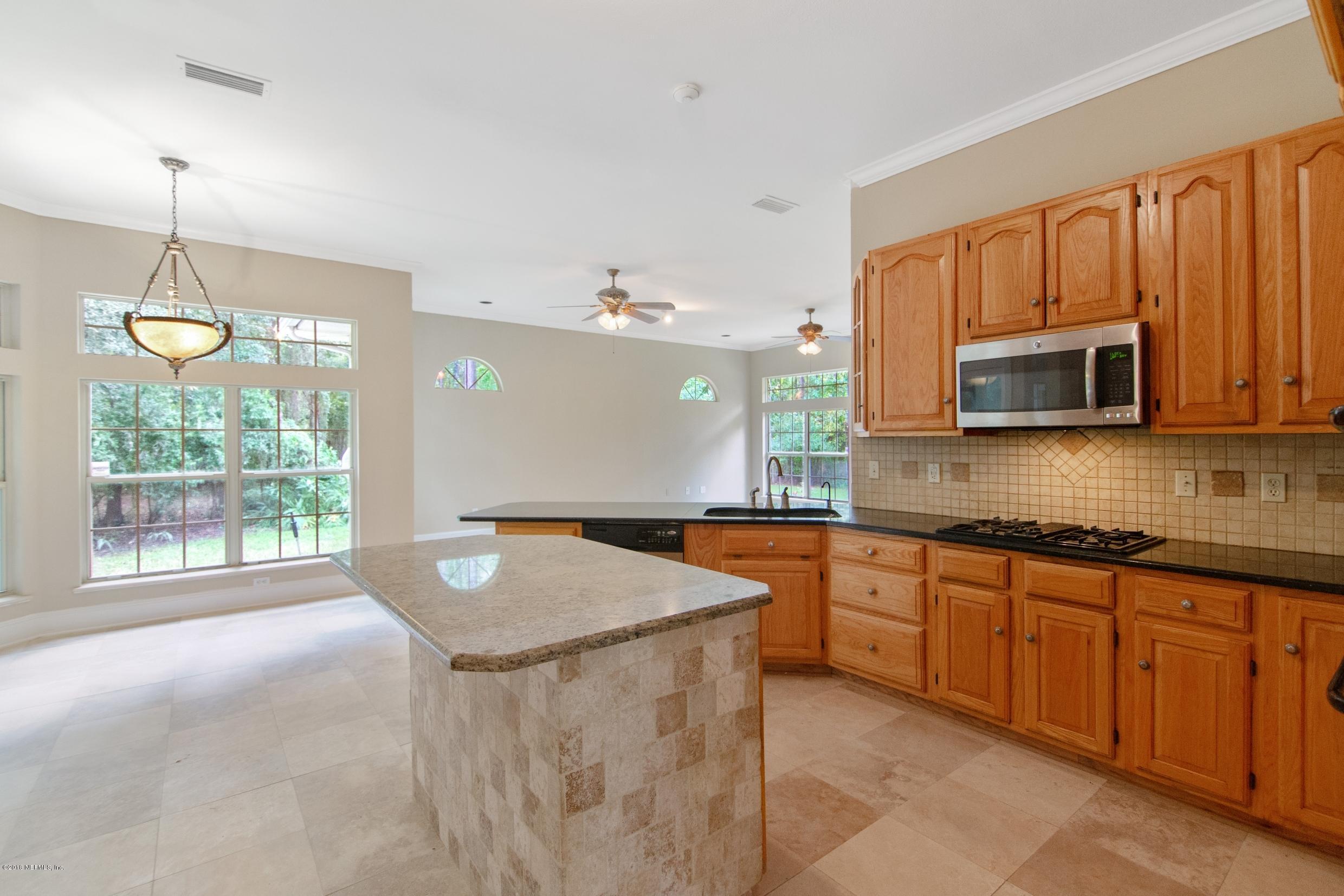 1899 Commodore Point Drive Orange Park, FL 32003 - Photo 41 of 52 a kitchen that has a sink a stove and microwave