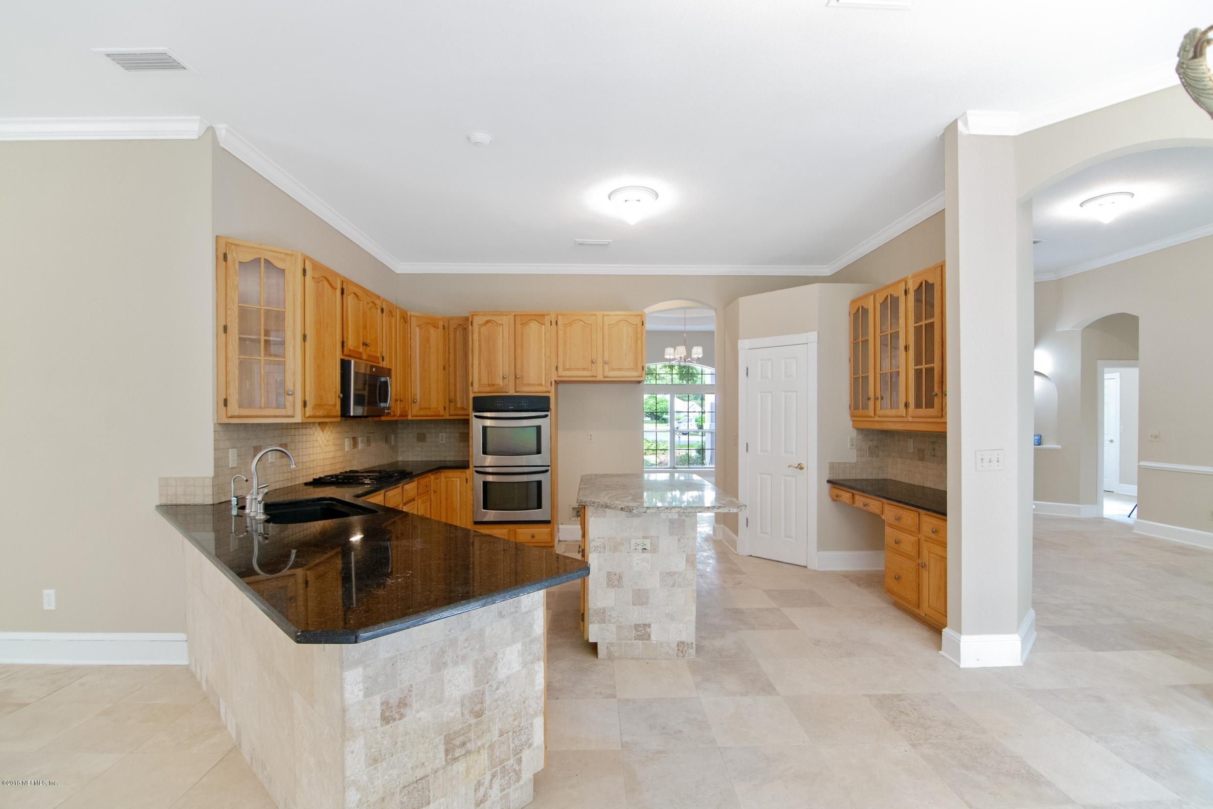 1899 Commodore Point Drive Orange Park, FL 32003 - Photo 7 of 52 a kitchen with stainless steel appliances a stove a sink and a refrigerator