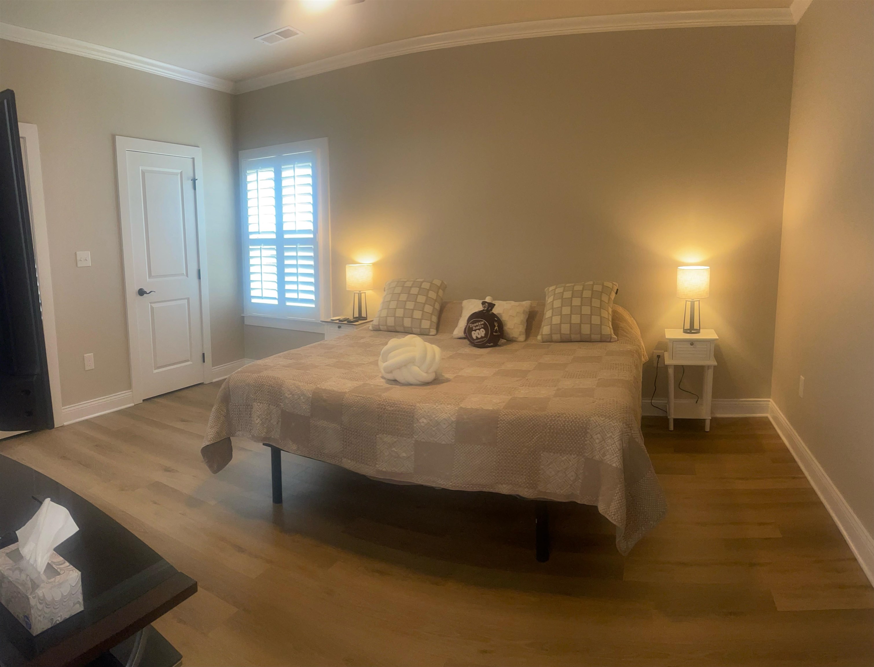210 Church Street Ripley, TN 38063 - Photo 9 of 21 Bedroom featuring wood-finish flooring, neutral wall tones, and white trim