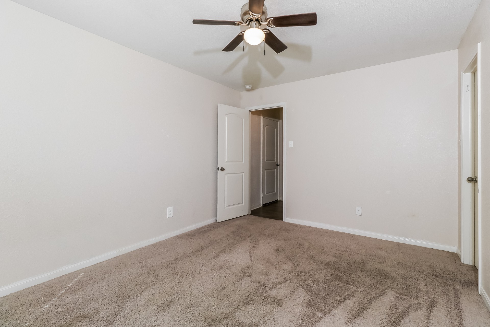 20017 Hubert R Humphrey Road Manor, TX 78653 - Photo 14 of 27 A well-proportioned bedroom with neutral walls and soft carpeting awaits personalization.