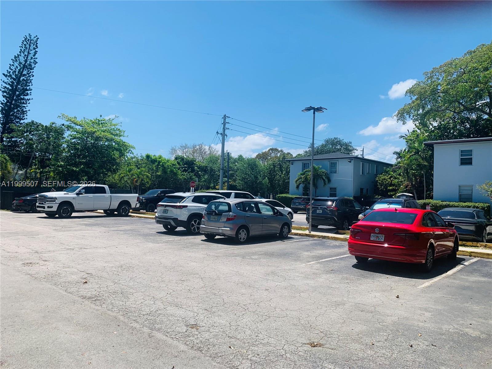 5605 Southwest 80th Street, Unit 97A Miami, FL 33143 - Photo 11 of 25 a car parked in front of a house
