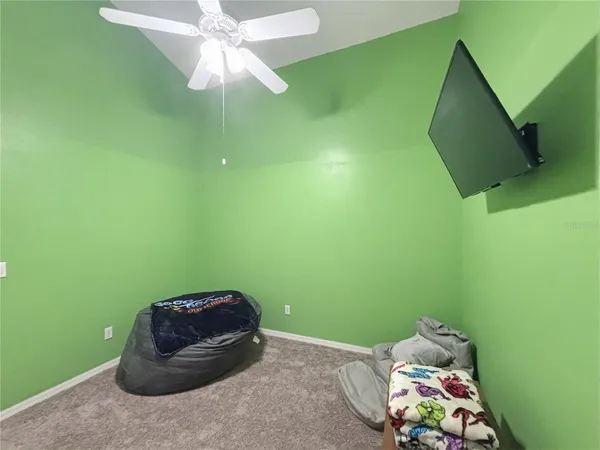 a room with window and fan