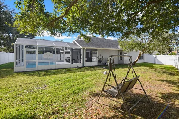 a view of swimming pool with a backyard