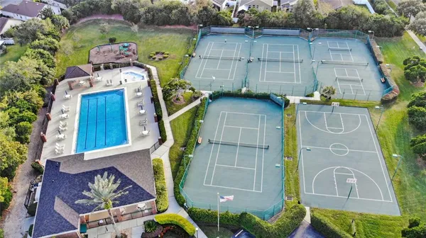 an aerial view of a house with a swimming pool outdoor seating and yard