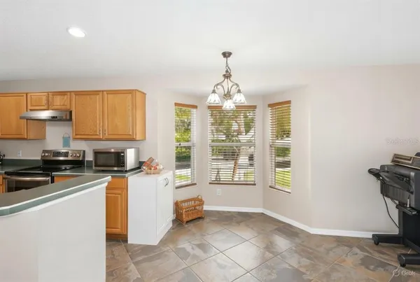 a kitchen with sink cabinets and window