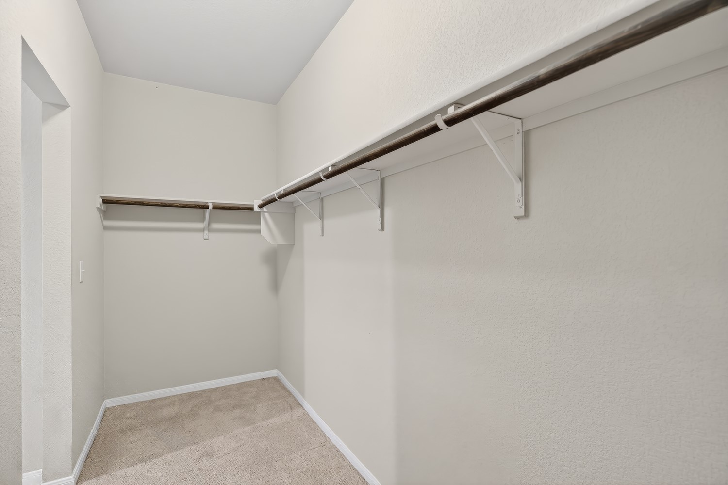 2006 Grow Lane Austin, TX 78754 - Photo 14 of 40 Discover abundant storage with built-in shelving and hanging rods in this spacious walk-in closet.