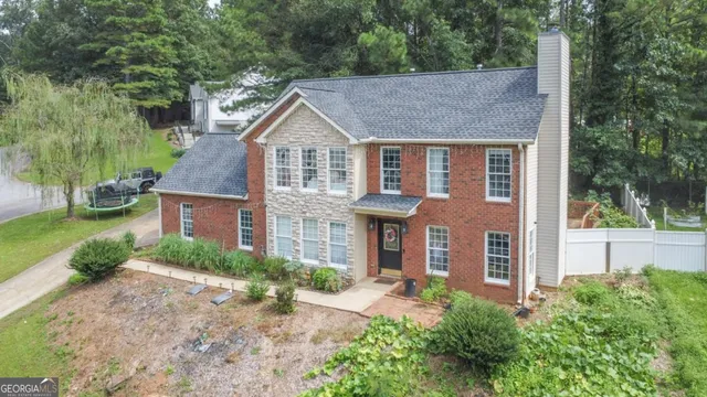 a front view of a house with garden
