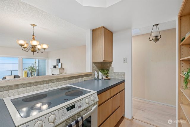a kitchen with a sink and a stove top oven