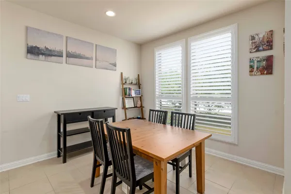 a view of a dining room with furniture and window