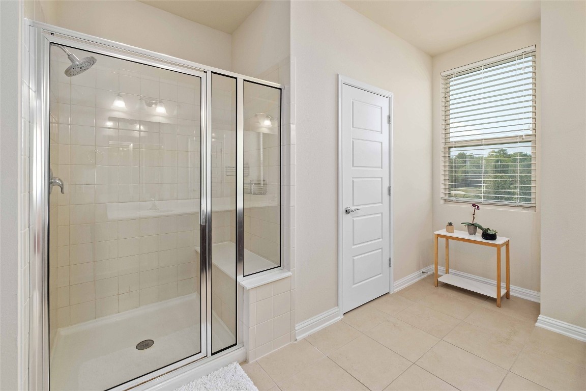 6814 East Riverside Drive, Unit 31 Austin, TX 78741 - Photo 16 of 25 a bathroom with a tub shower and sink