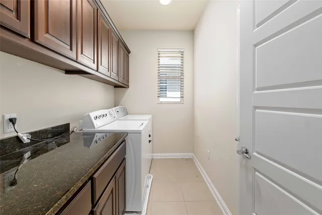 a utility room with cabinets