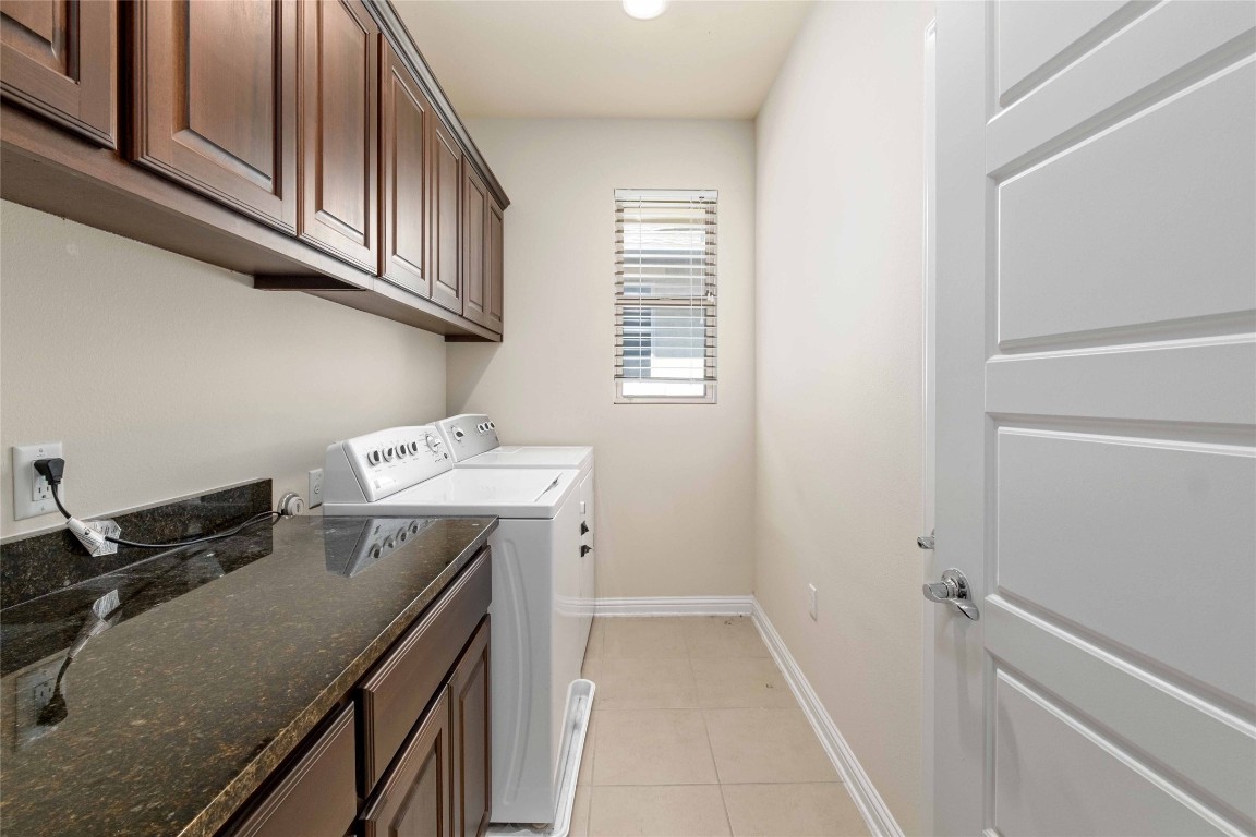 6814 East Riverside Drive, Unit 31 Austin, TX 78741 - Photo 18 of 25 a utility room with cabinets