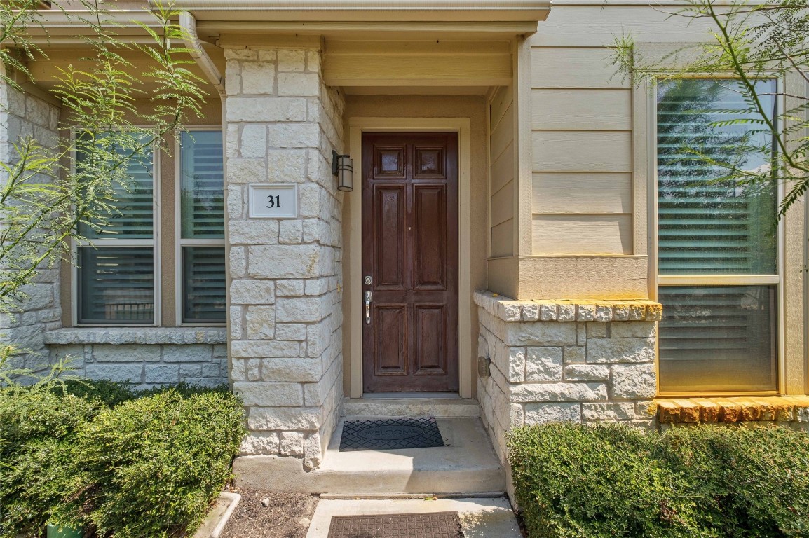 6814 East Riverside Drive, Unit 31 Austin, TX 78741 - Photo 24 of 25 a front view of a house with a yard