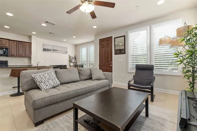 a living room with furniture and a window