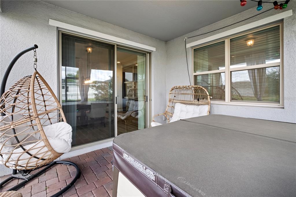 6699 Alder Road St. Cloud, FL 34773 - Photo 27 of 51 a bedroom with a bed and glass door