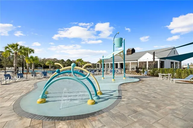 a view of a swimming pool with lounge chair