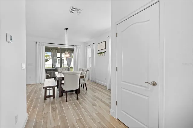a dining room with furniture and window
