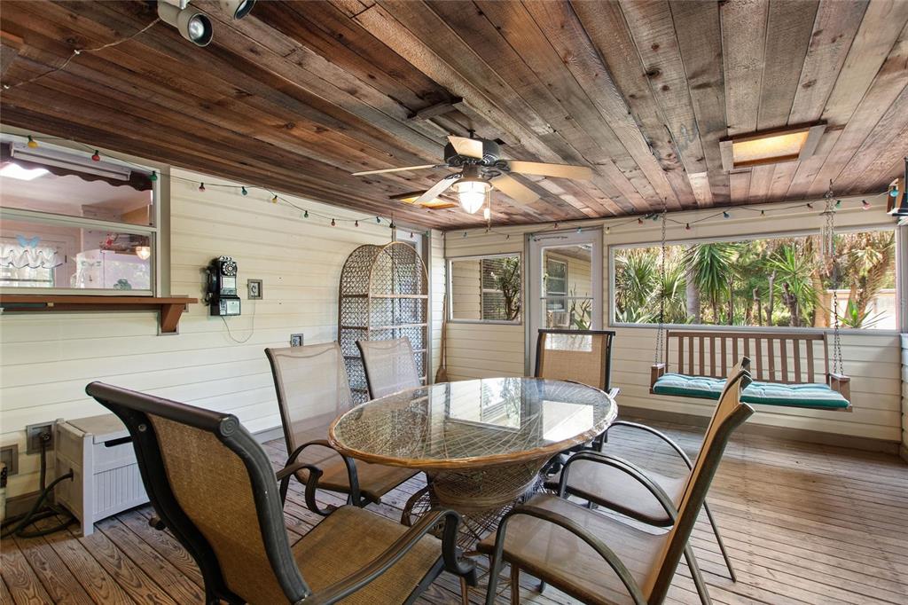 3641 Turtle Mound Road Melbourne, FL 32934 - Photo 16 of 77 a view of a dining room with furniture window and wooden floor