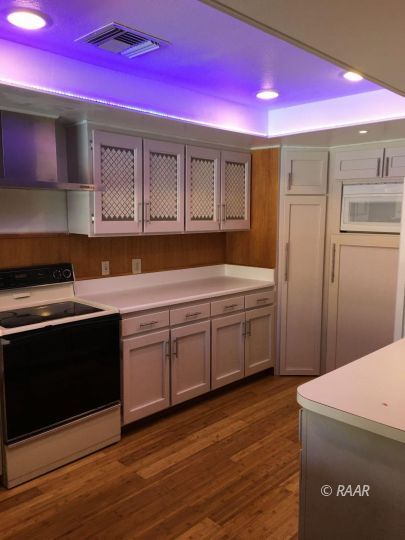 224 West Rader Avenue Ridgecrest, CA 93555 - Photo 8 of 26 a kitchen with a sink a stove and cabinets