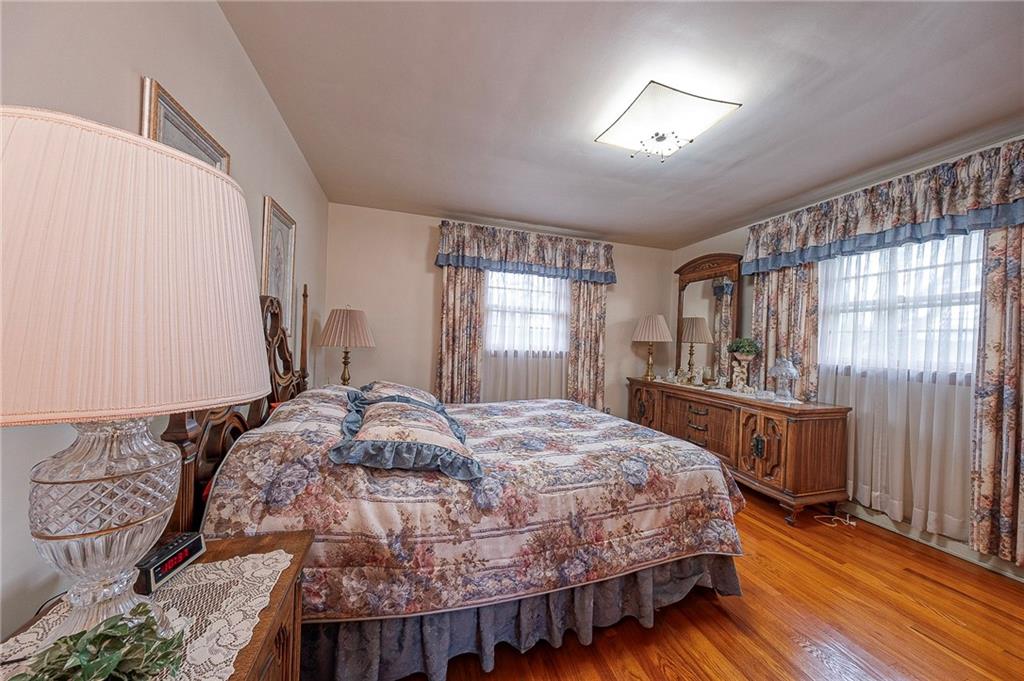 1913 Brigadoon Lane New Castle, PA 16101 - Photo 14 of 30 a bedroom with a bed and wooden floor