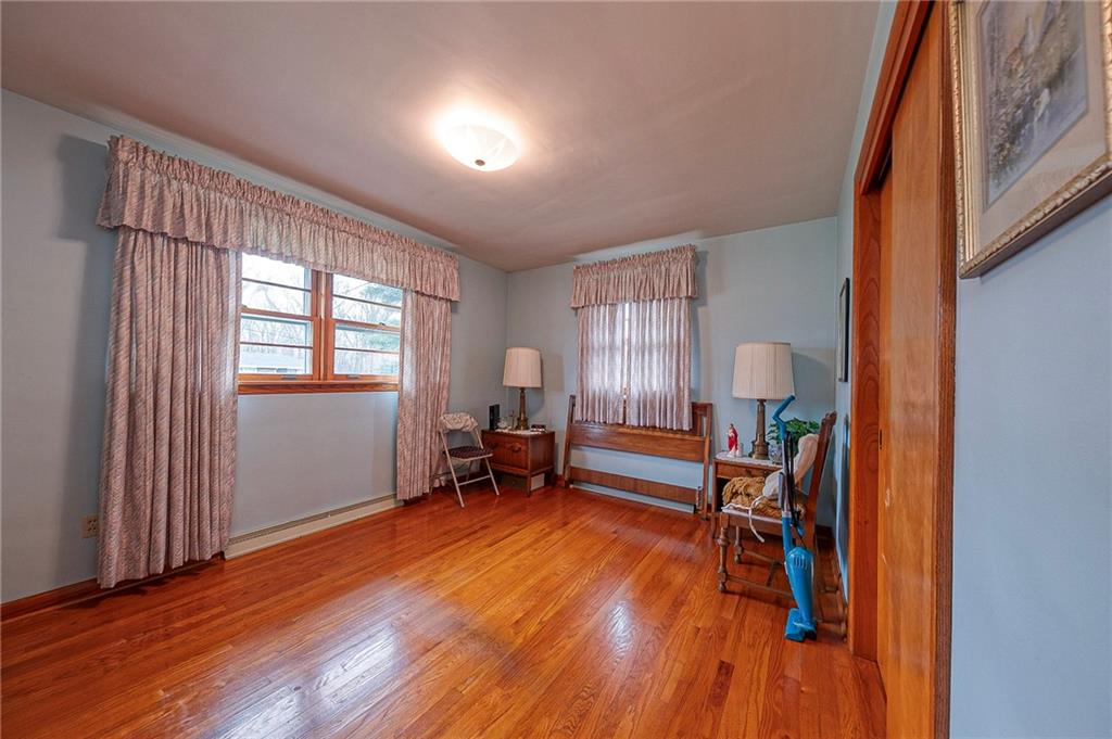 1913 Brigadoon Lane New Castle, PA 16101 - Photo 18 of 30 an empty room with wooden floor and furniture