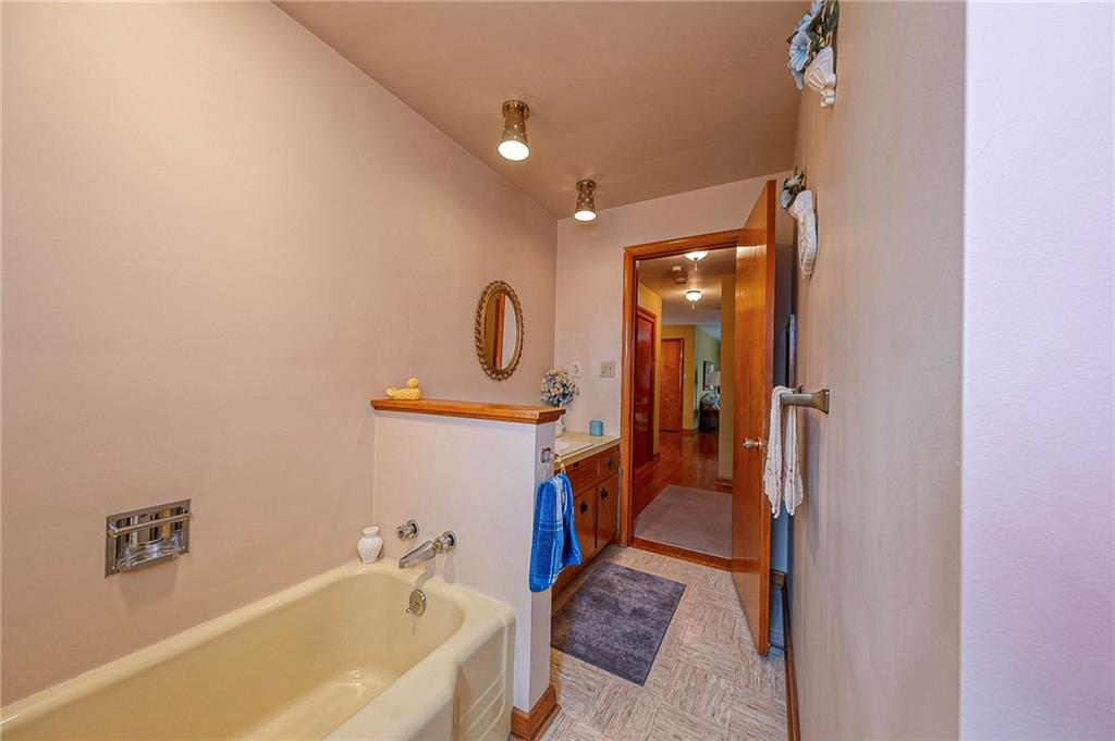 1913 Brigadoon Lane New Castle, PA 16101 - Photo 22 of 30 a bathroom with a tub sink and mirror