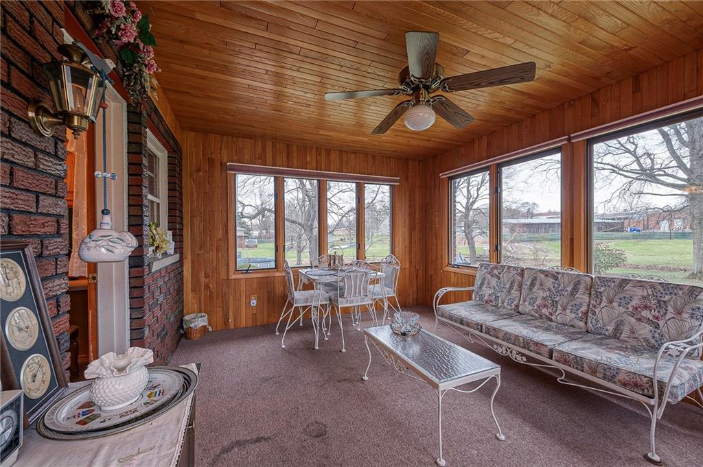 1913 Brigadoon Lane New Castle, PA 16101 - Photo 23 of 30 a living room with furniture a fireplace and a large window