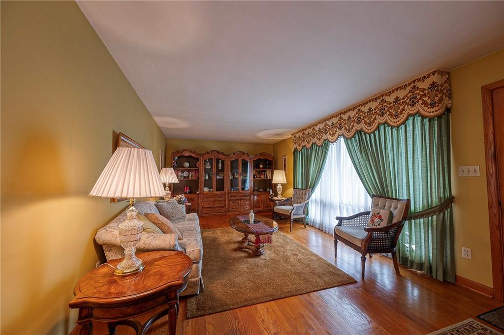 1913 Brigadoon Lane New Castle, PA 16101 - Photo 6 of 30 a living room with furniture a rug and a wooden floor