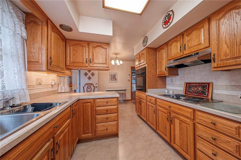 1913 Brigadoon Lane New Castle, PA 16101 - Photo 8 of 30 a kitchen with stainless steel appliances granite countertop a sink and cabinets