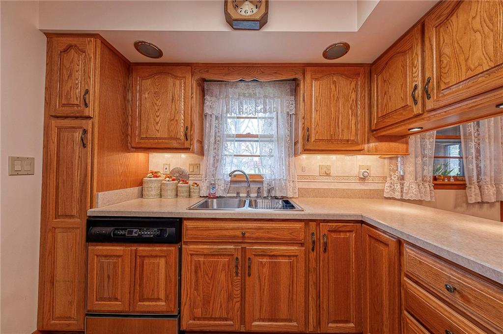1913 Brigadoon Lane New Castle, PA 16101 - Photo 9 of 30 a kitchen with stainless steel appliances granite countertop a sink stove and cabinets