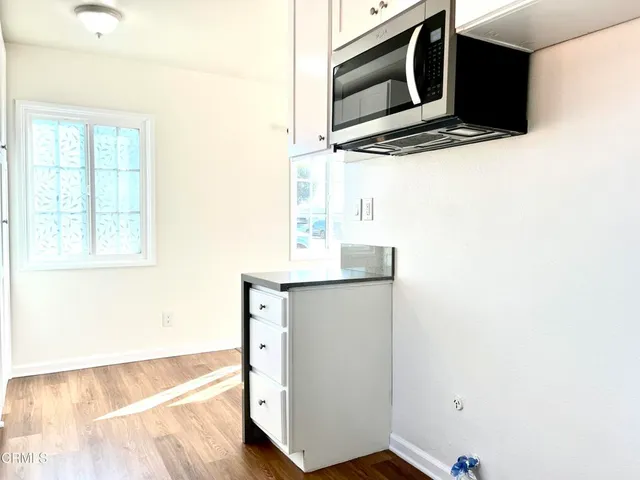 a kitchen with granite countertop white cabinets and a granite counter tops