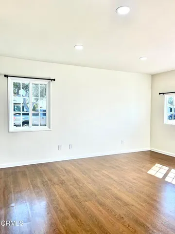view of an empty room with a large window