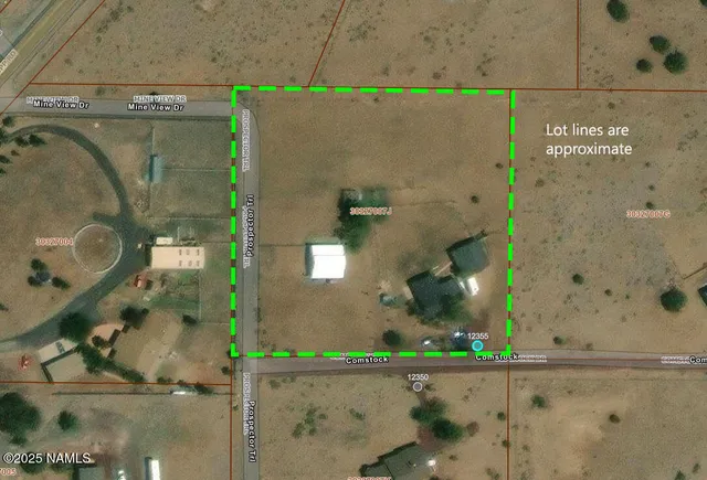 an aerial view of a residential building with outdoor space