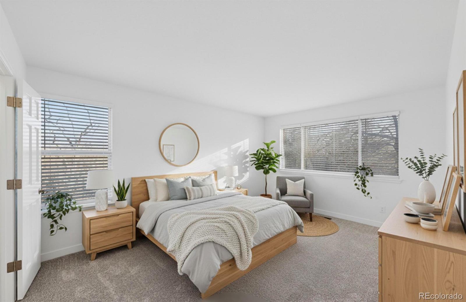 9195 Sugarstone Circle Highlands Ranch, CO 80130 - Photo 14 of 37 a bedroom with bed and a large window