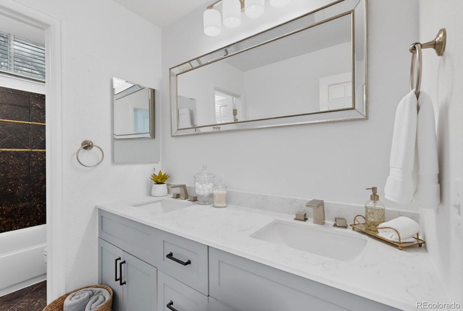 9195 Sugarstone Circle Highlands Ranch, CO 80130 - Photo 15 of 37 a bathroom with a sink and a mirror