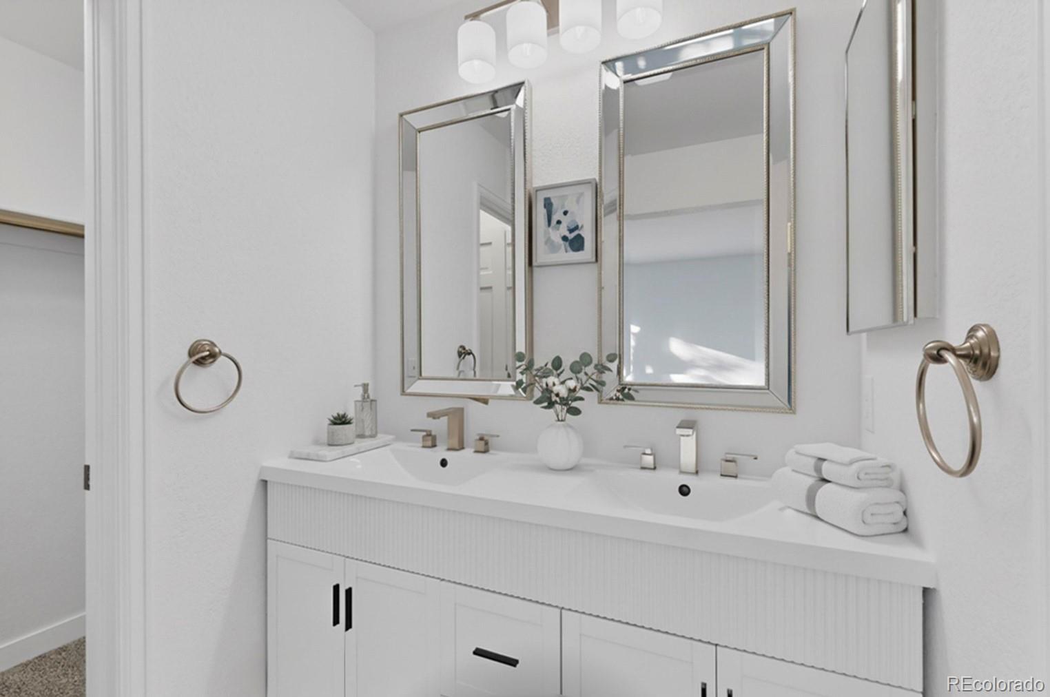 9195 Sugarstone Circle Highlands Ranch, CO 80130 - Photo 17 of 37 a bathroom with a sink and a mirror