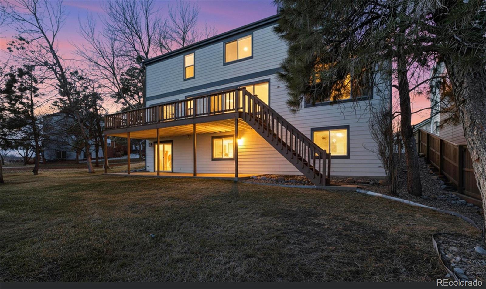 9195 Sugarstone Circle Highlands Ranch, CO 80130 - Photo 21 of 37 a view of a house with a yard