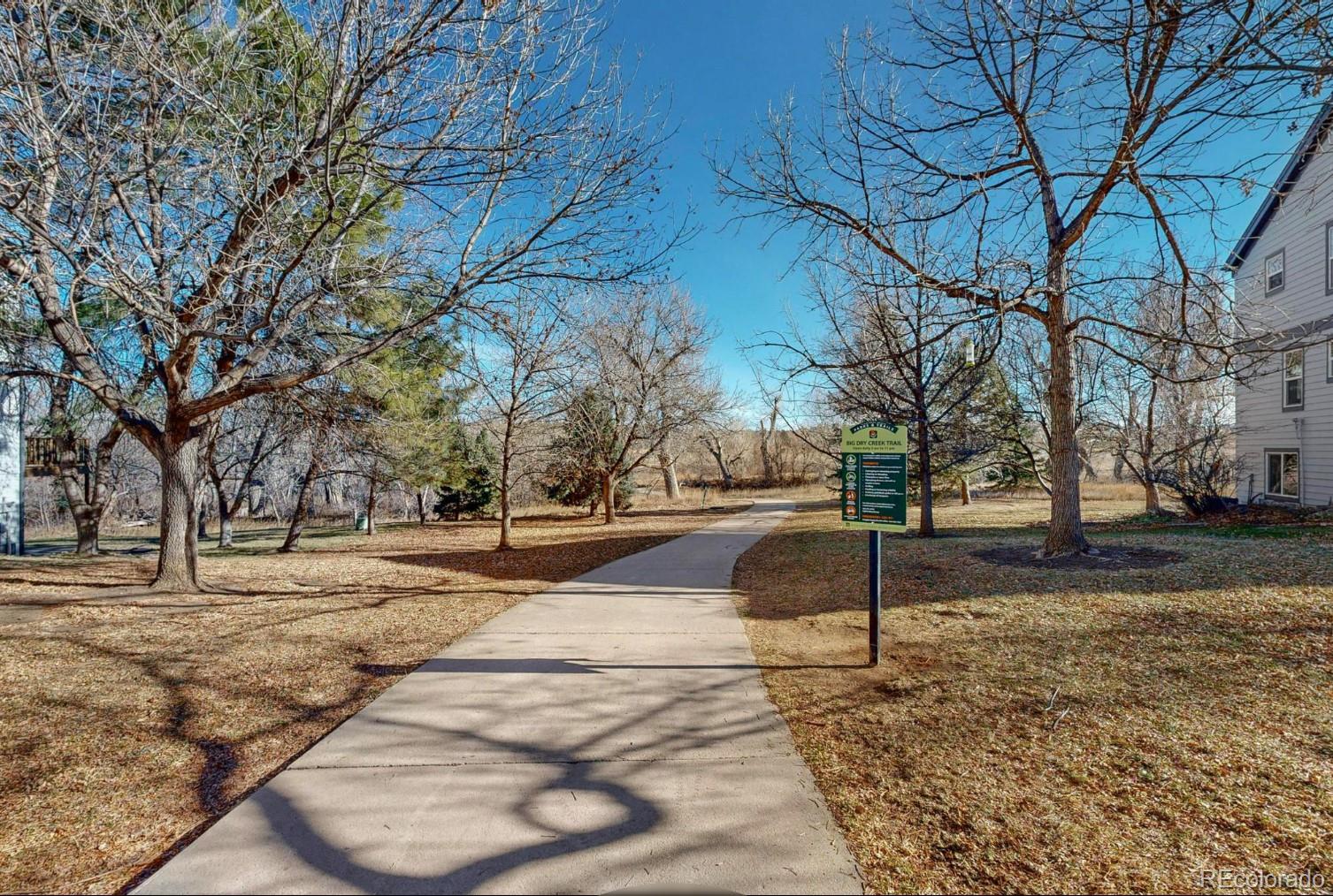 9195 Sugarstone Circle Highlands Ranch, CO 80130 - Photo 31 of 37 a street view with large trees