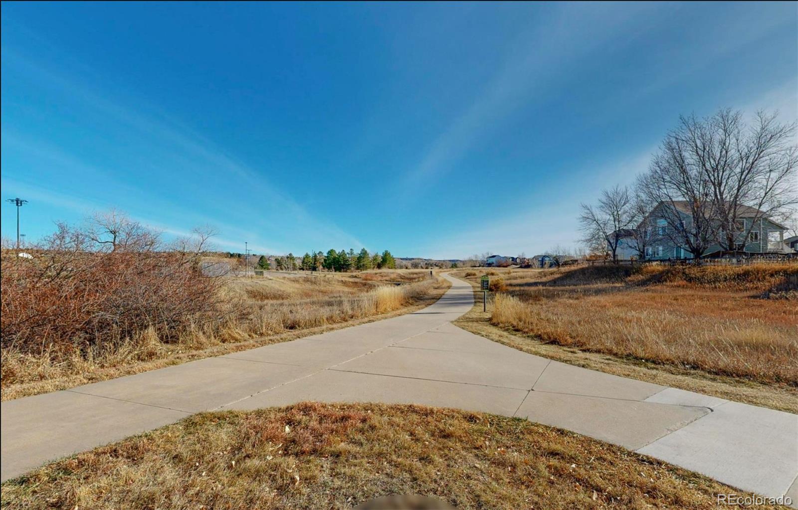 9195 Sugarstone Circle Highlands Ranch, CO 80130 - Photo 36 of 37 a view of a road with an ocean view
