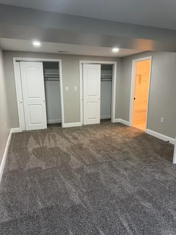 a view of an empty room and closet area