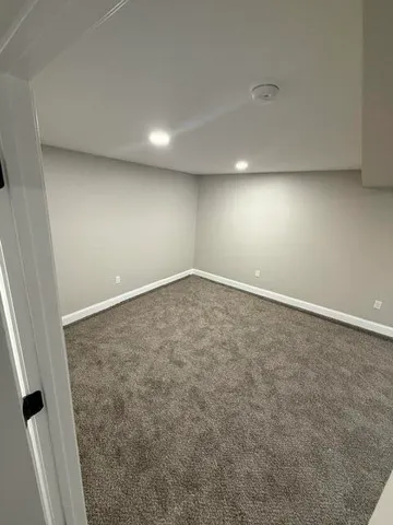 an empty room with a bench