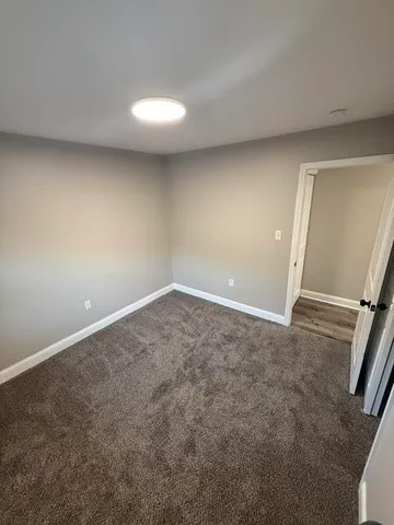wooden floor and window in an empty room