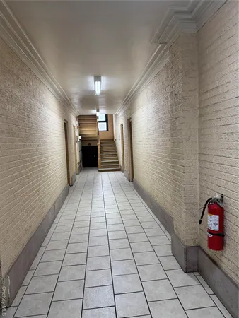 a view of a hallway with seating area
