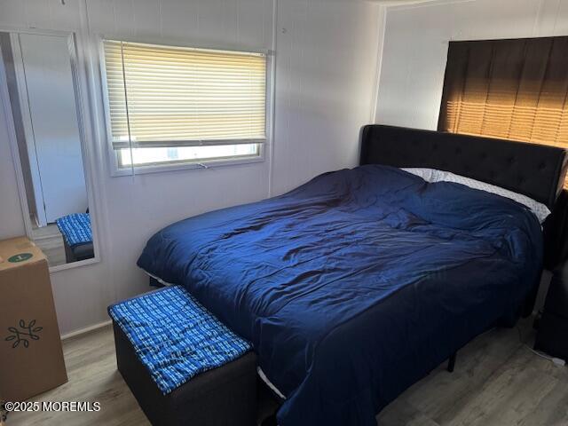 127 Lane B Hazlet, NJ 07730 - Photo 11 of 13 a bed sitting in a bedroom next to a window